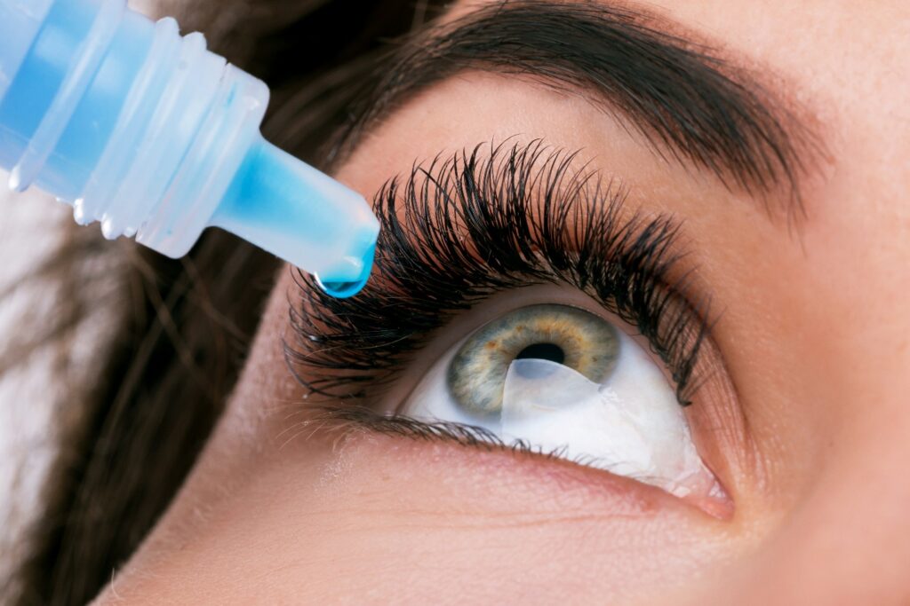 Close up of female face and eye drops