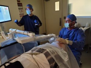 patient and surgeon in the operating room during eye surgery