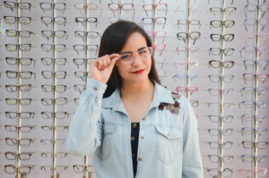 Beautiful girl in glasses on a background.